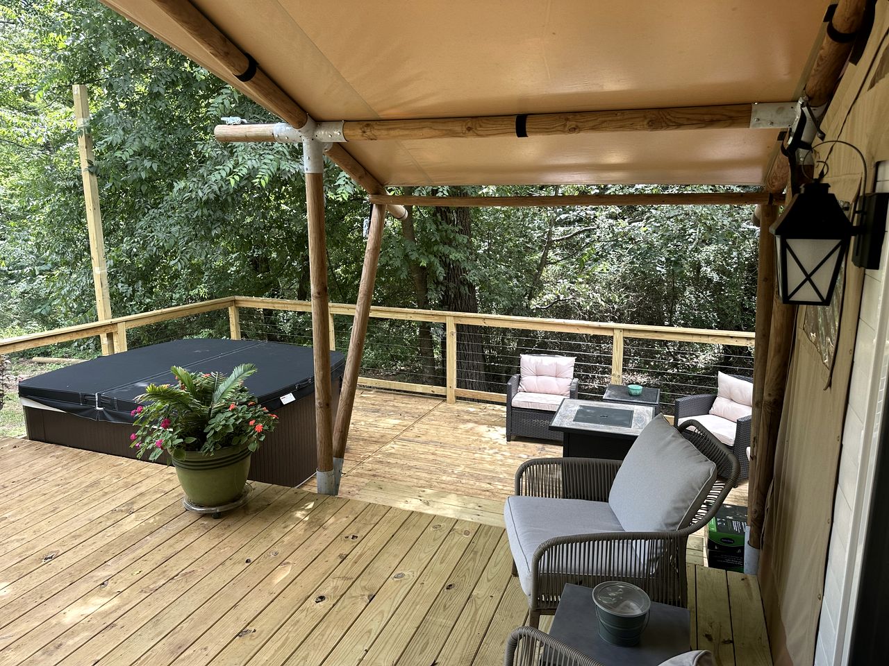 Mistletoe covered deck with hot tub and lounge seating